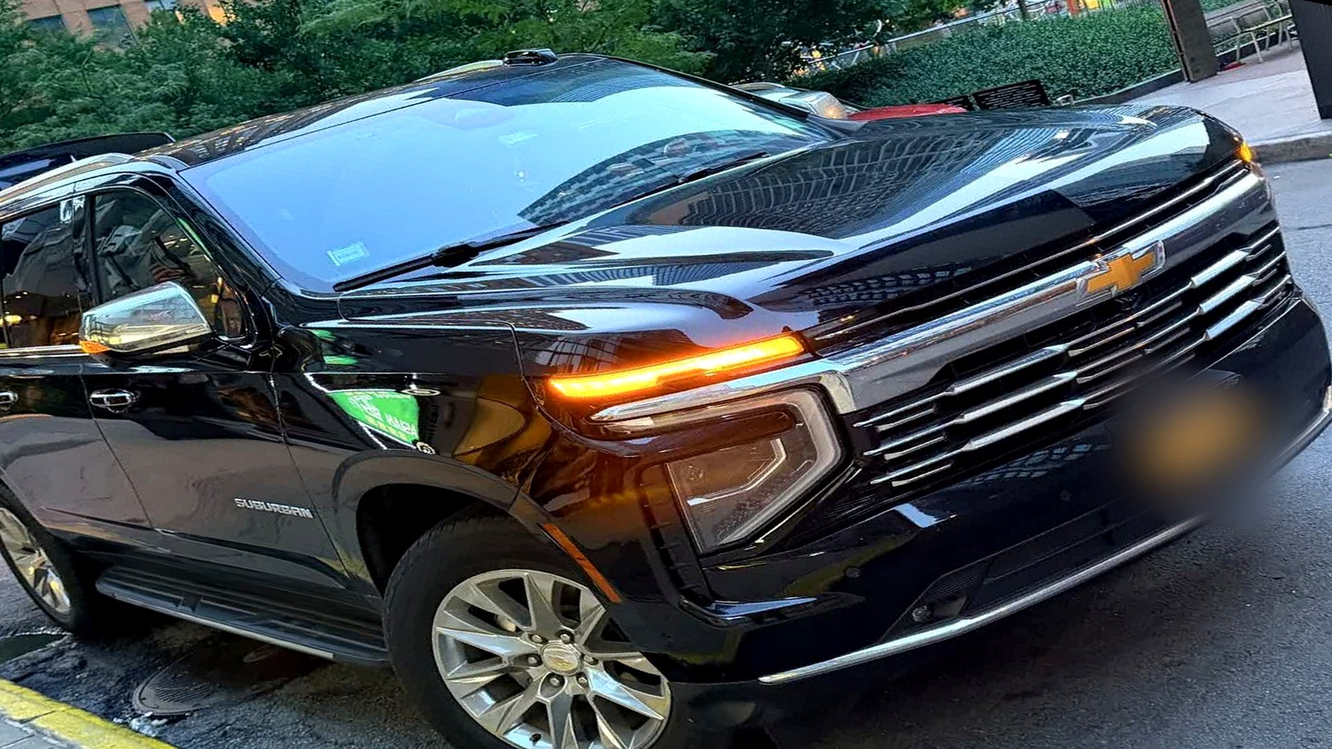 EJV black Chevrolet Suburban in New York City at dusk