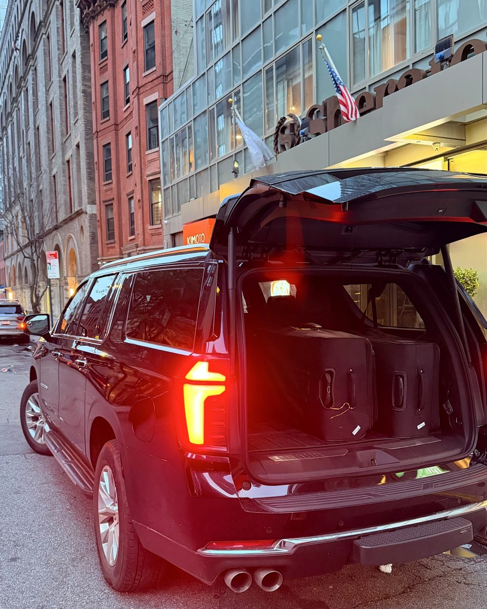 EJV Suburban at a Manhattan hotel entrance
